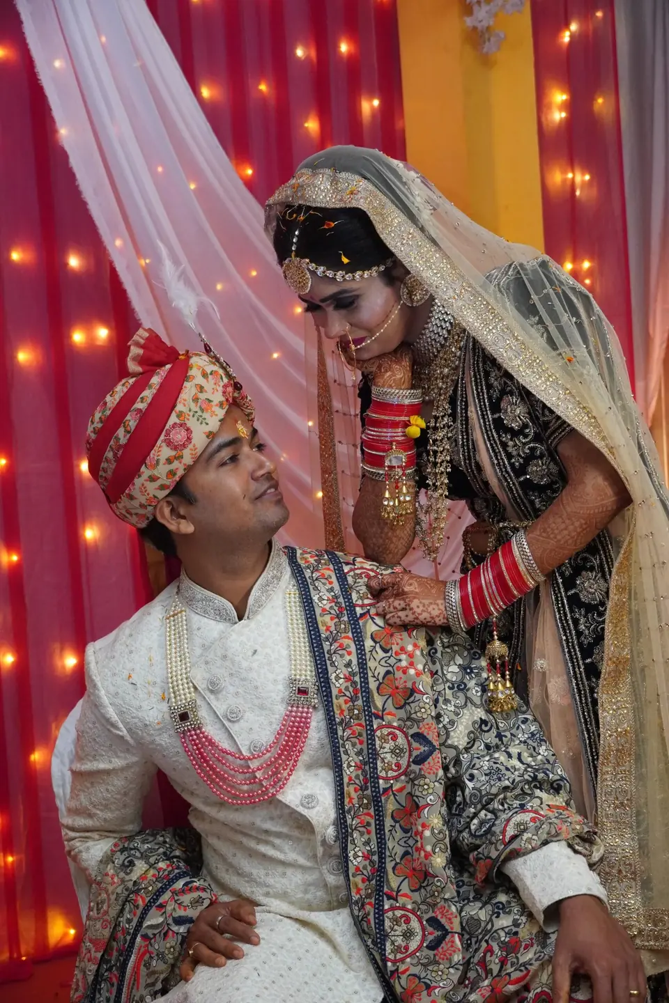 Bride and groom sharing a candid moment during wedding festivities